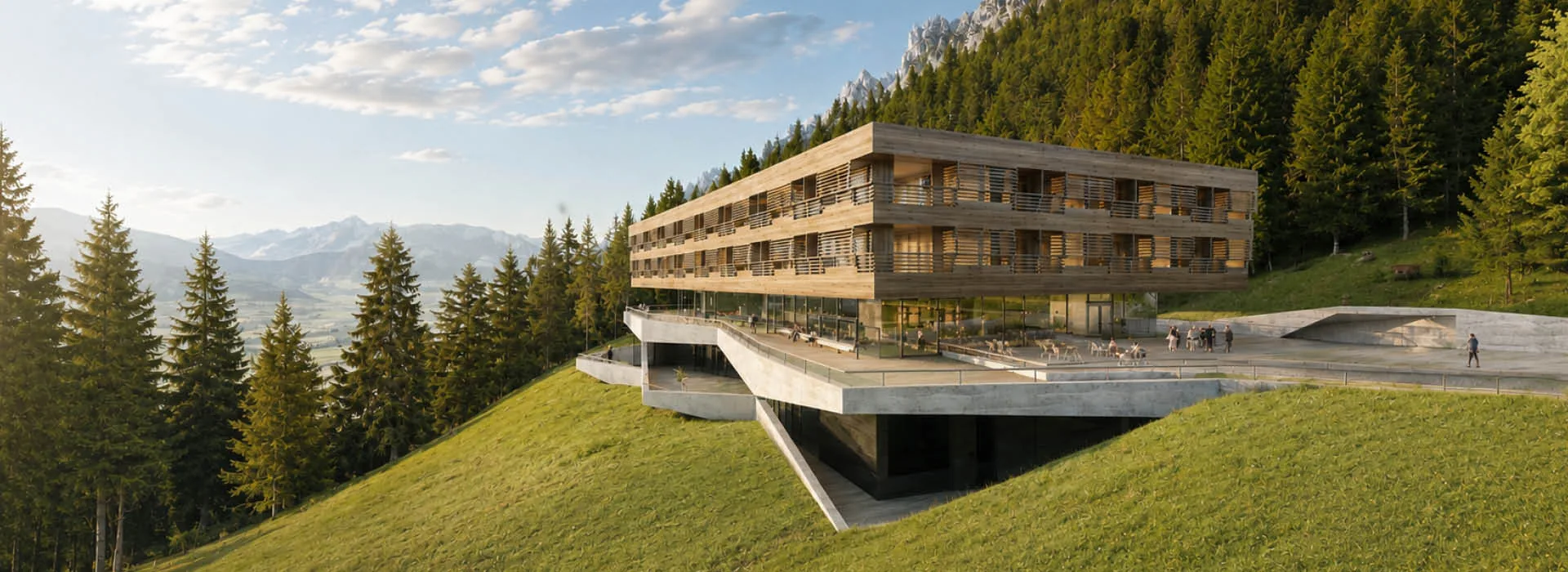 Four-storey timber clinic building on a green slope between spruce forest and alpine peaks in summer